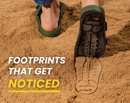 Green Sand-U Footprint sandals walking on the sand and leaving a bold signature sole print. 