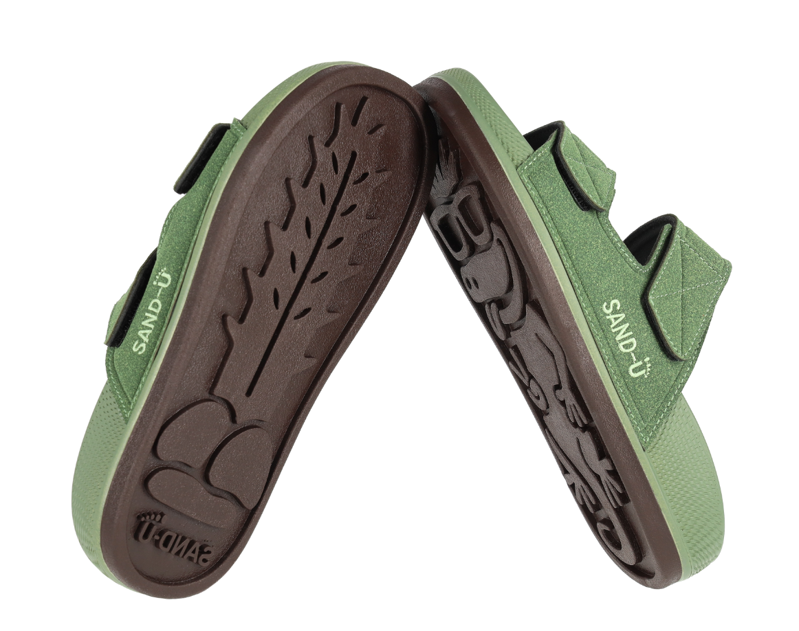 Green Sand-U showing the signature cactus and lizard inspired sole design on a white background.